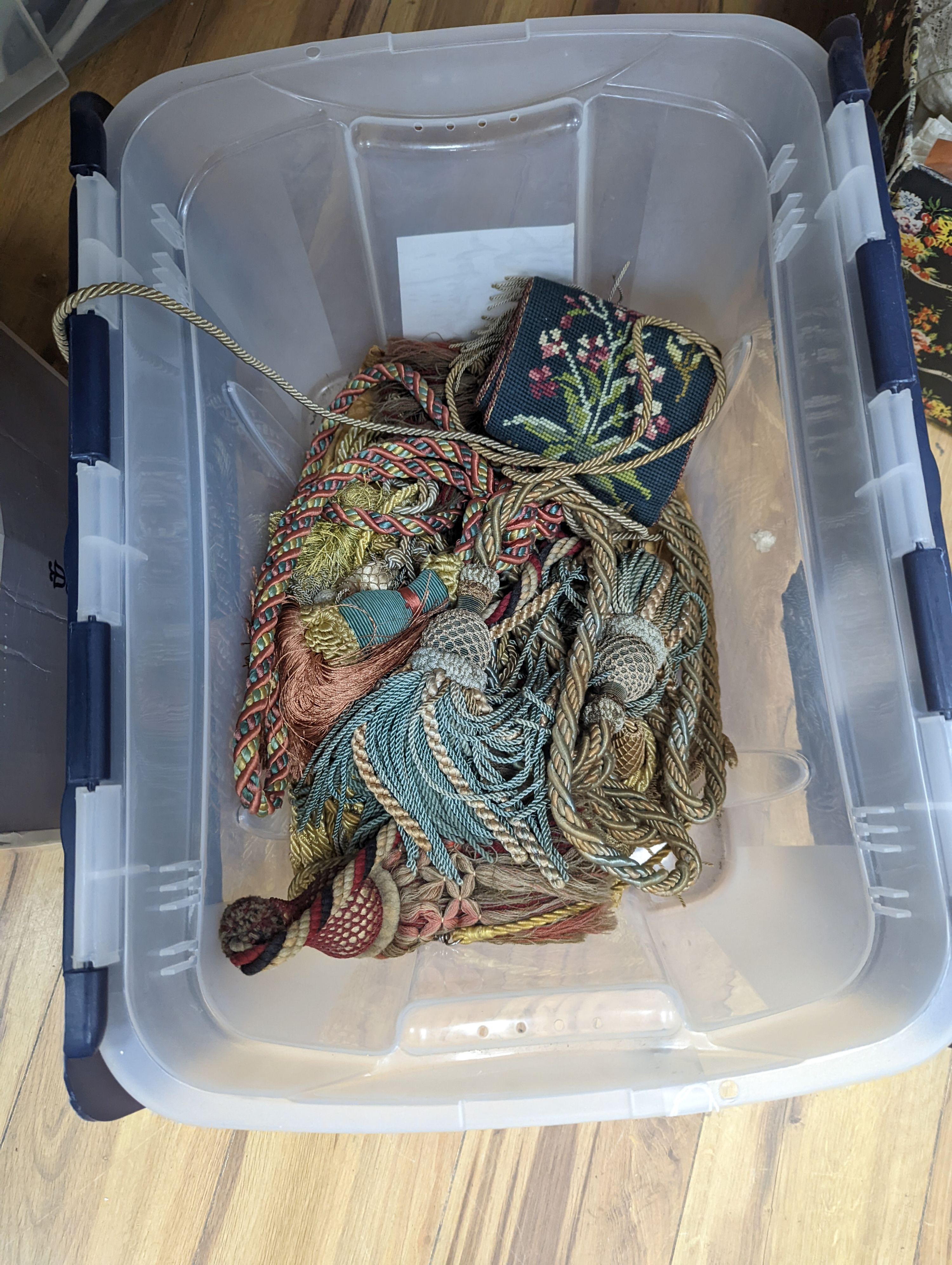 A length of 19th century damask, a 1930's chenille curtain and a collection of tasselled tie backs